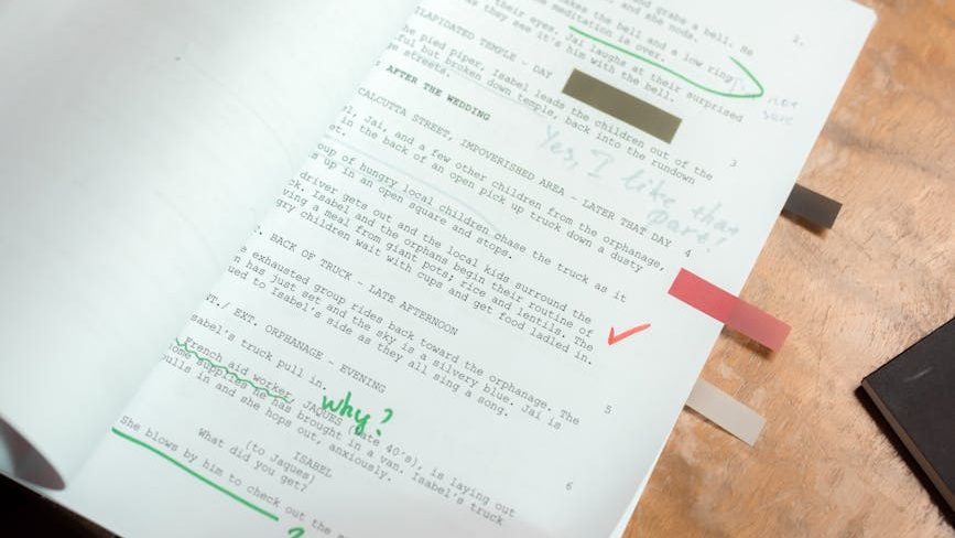 a typed script with editing notes written on it
